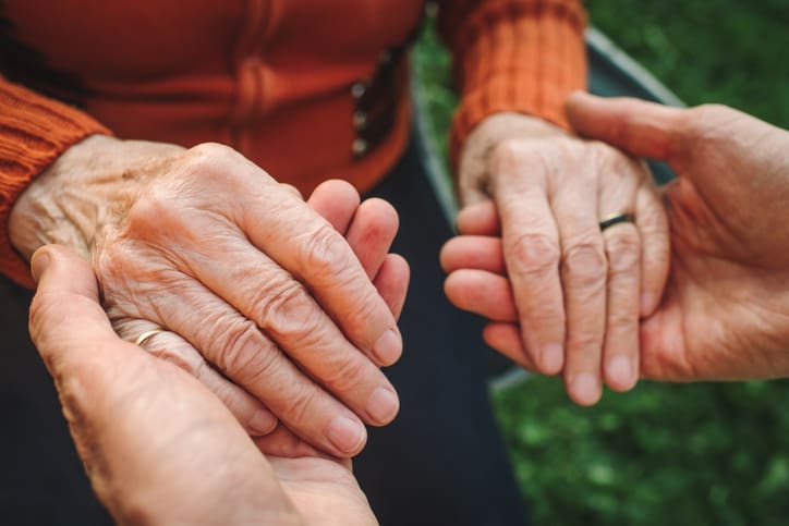 Close-up of holding an elderly woman's hands